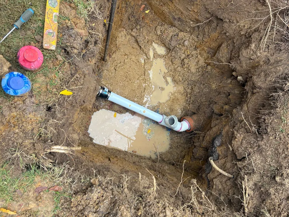 Underground drain line exposed for repair
