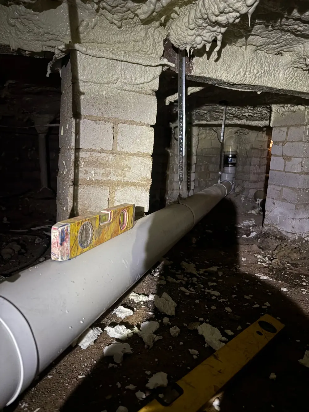 Subfloor drainage repair with new pipework