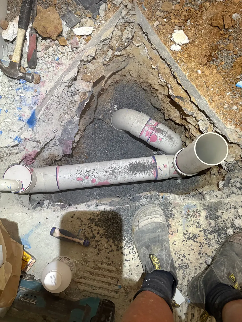 Underground drainage junction exposed during repair