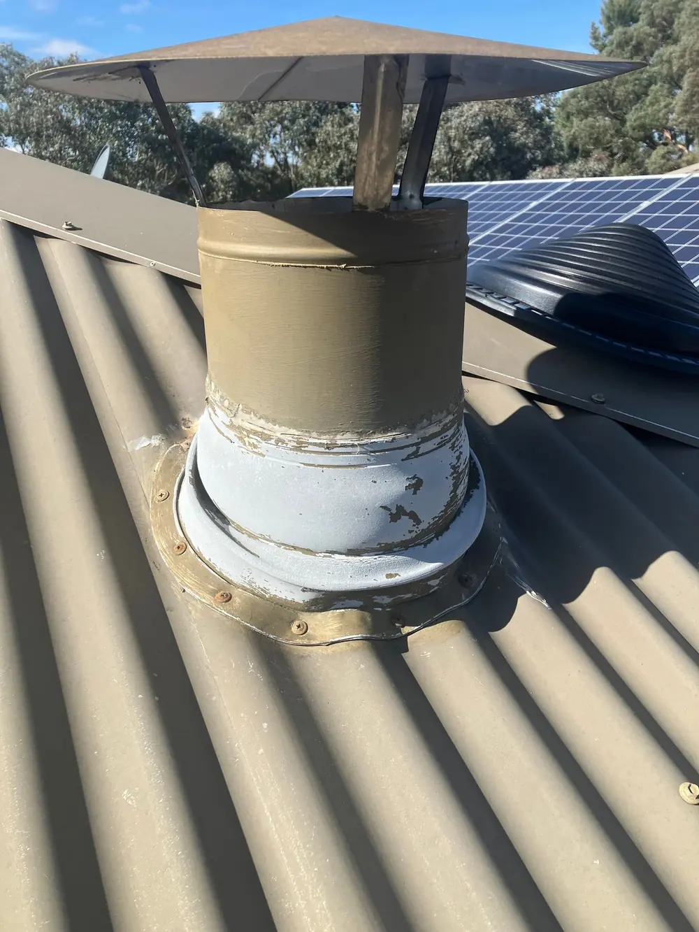 Roof penetration and flashing around a plumbing vent